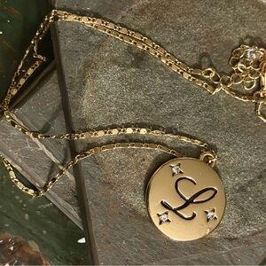 Gold tone celestial monogrammed "L" pendant necklace